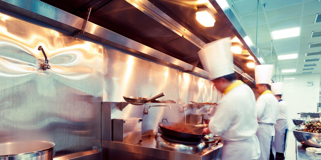 2 chefs working in a restaurant kitchen